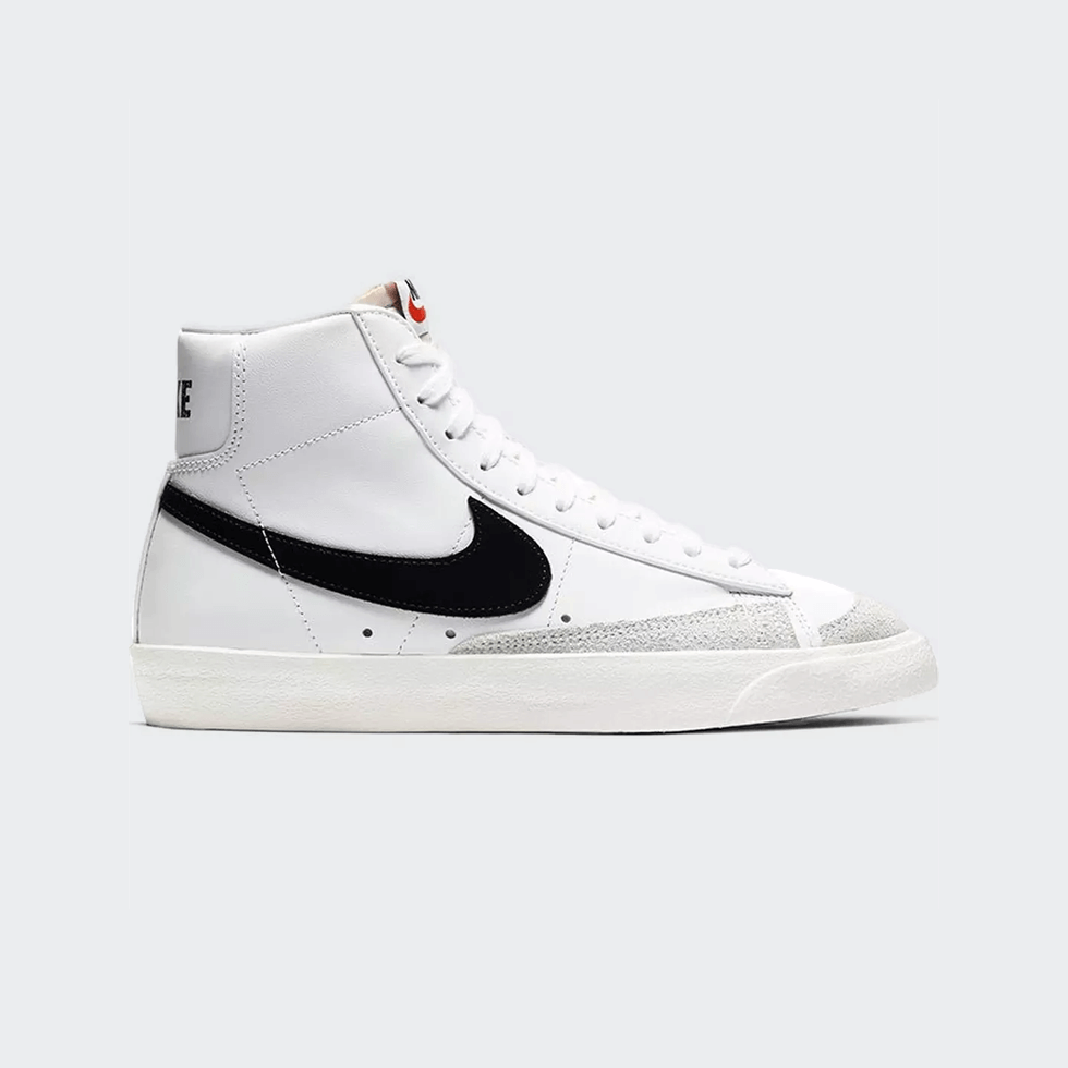 Sneaker Trends for Fall 2024: White high-top Nike Blazer Mid '77 Vintage with black swoosh.